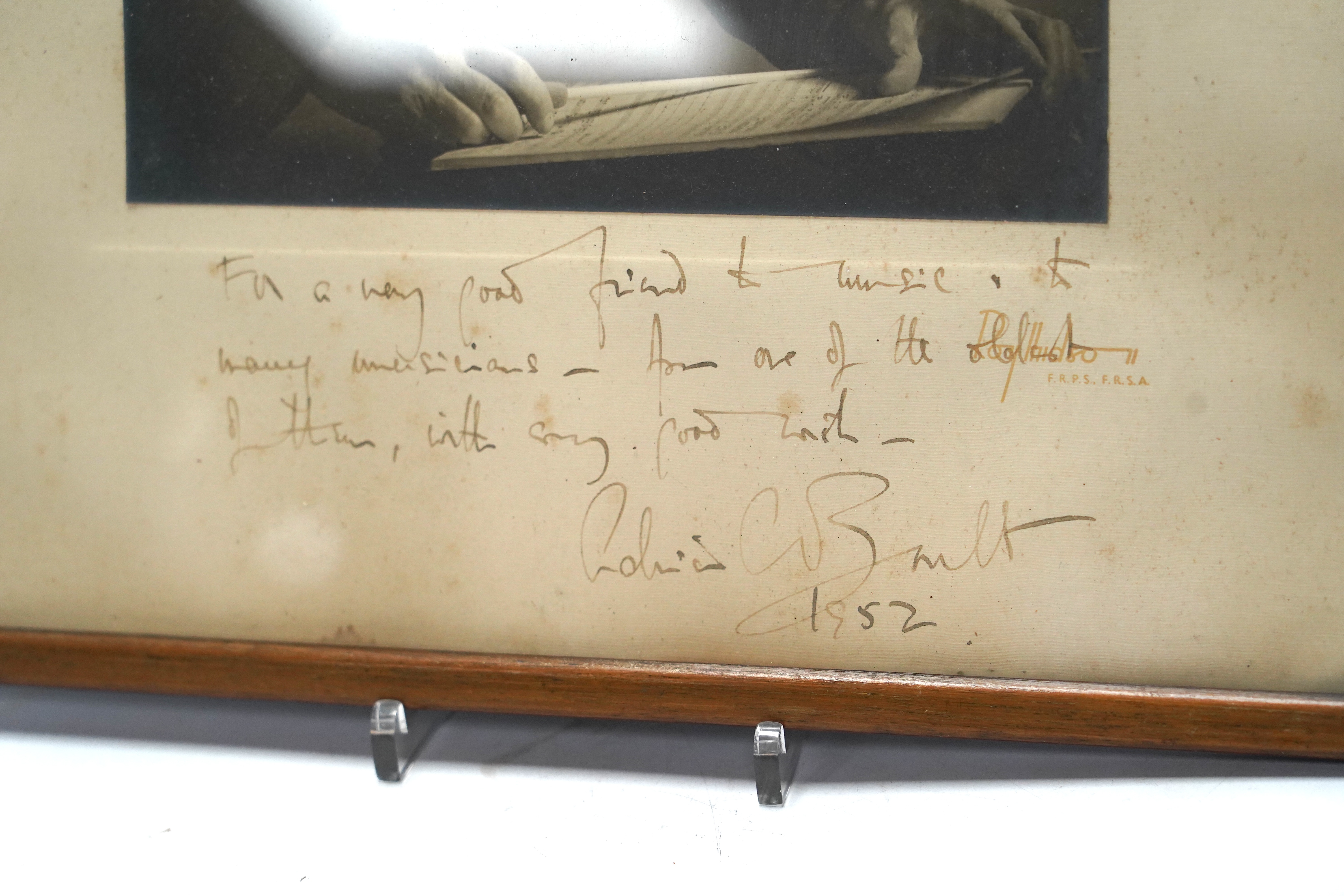 A signed photograph of the conductor Sir Adrian Boult with dedication dated 1952, frame 39.5 x 32cm